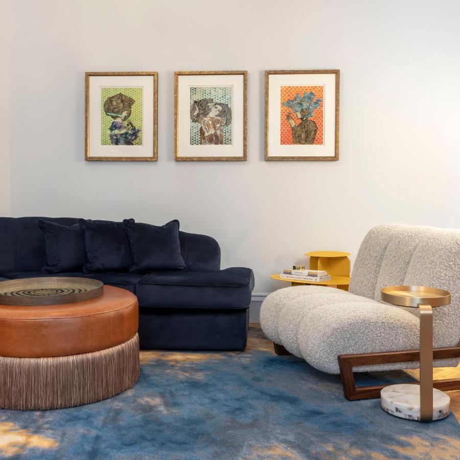 Virgin Hotels EDI Eksteriør billede A living room with a sofa, armchair and ottoman